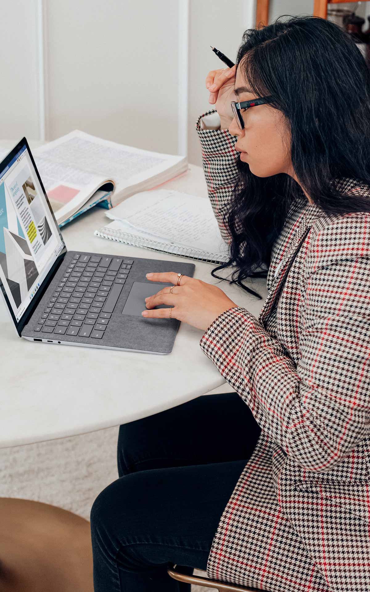 Female web designer working on laptop.